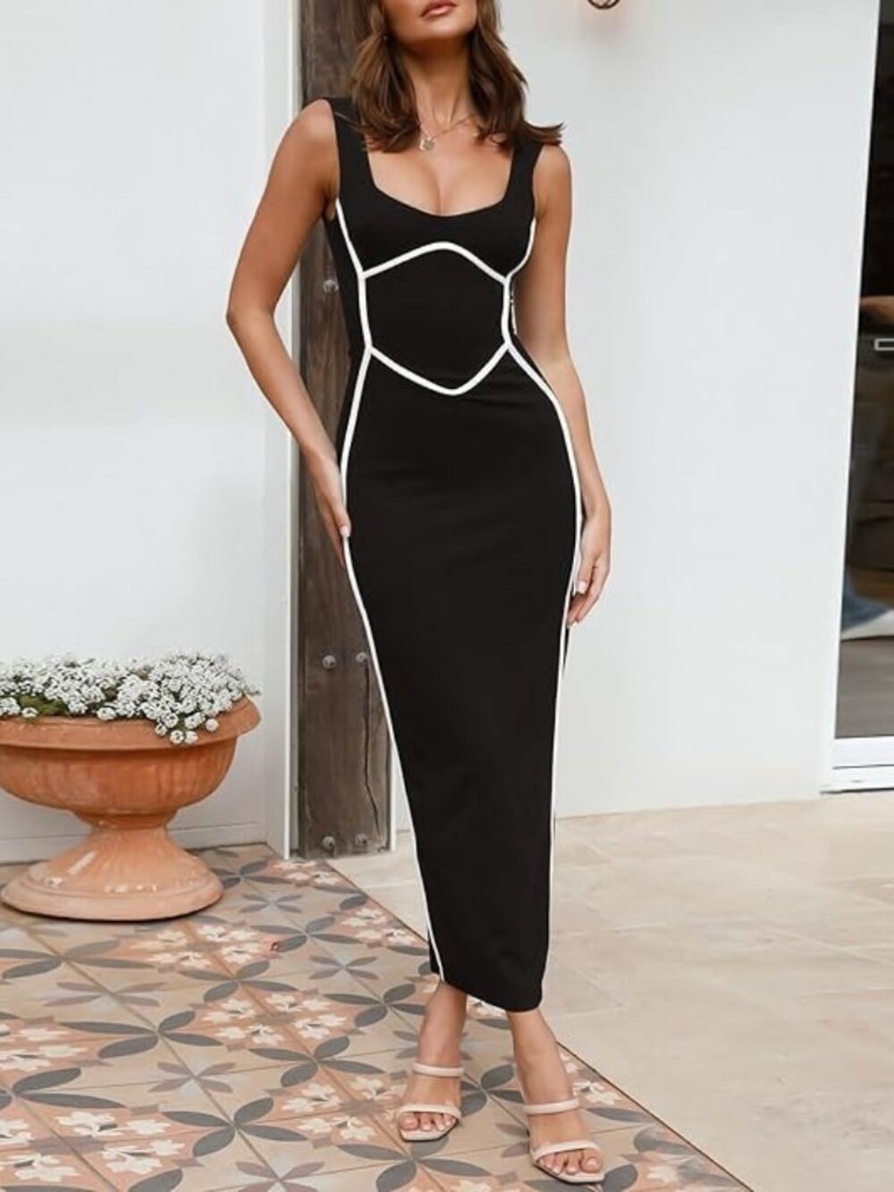 Black maxi dress with white contrast trim and slit in the back